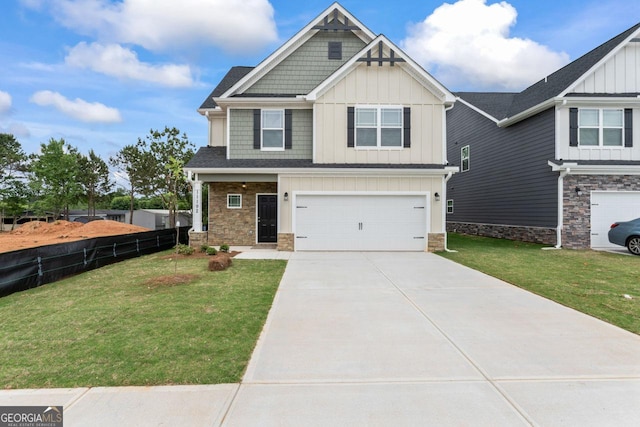 craftsman-style house featuring a garage, a front lawn, board and batten siding, and driveway