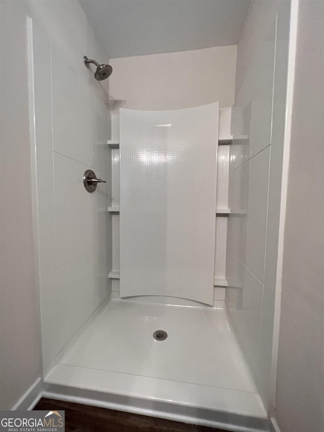 bathroom featuring walk in shower