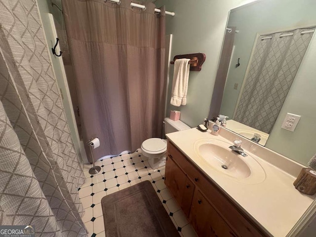 full bathroom with vanity and toilet