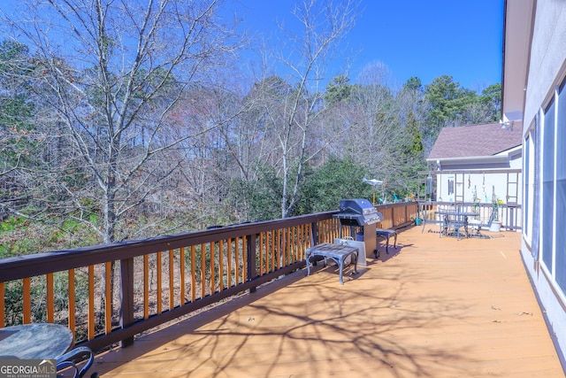 view of patio / terrace with outdoor dining area, grilling area, and a wooden deck