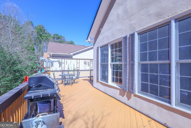 wooden deck featuring grilling area