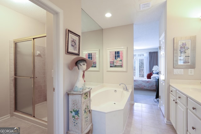 ensuite bathroom with a stall shower, visible vents, tile patterned floors, vanity, and a bath