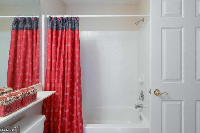 full bathroom featuring shower / bath combination with curtain and toilet