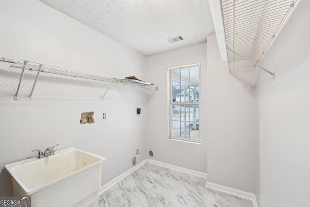 washroom with visible vents, laundry area, hookup for a washing machine, marble finish floor, and hookup for an electric dryer