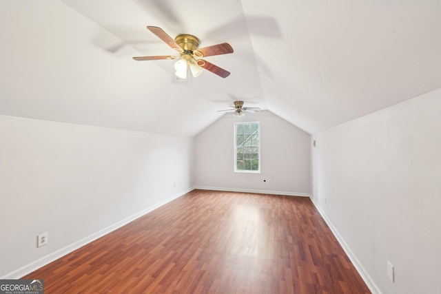 bonus room featuring a ceiling fan, lofted ceiling, wood finished floors, and baseboards