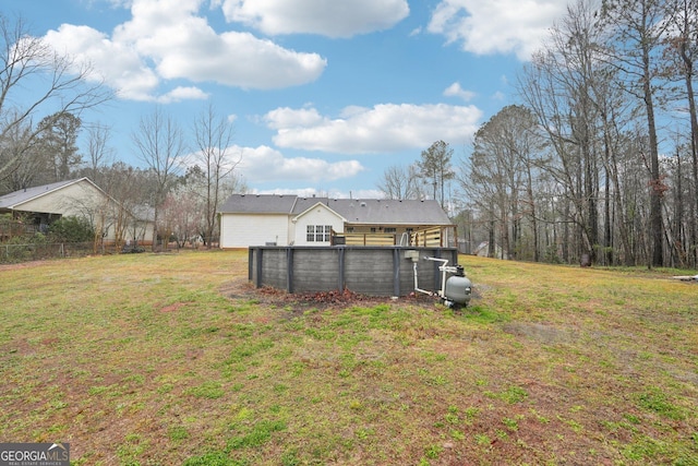 view of yard featuring a pool and fence