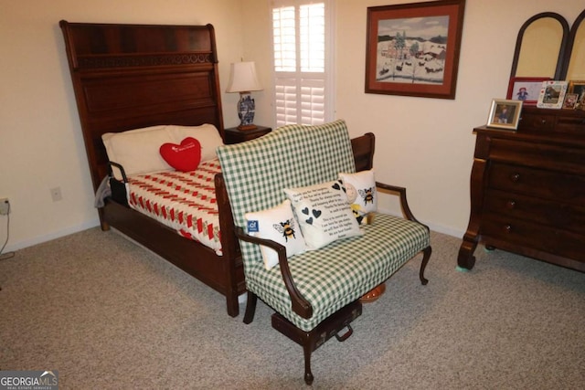 carpeted bedroom featuring baseboards