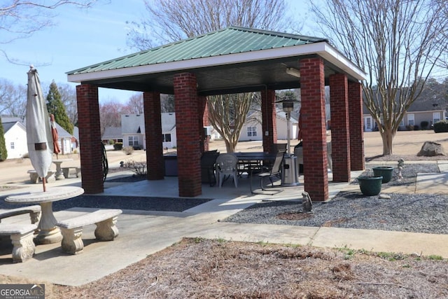 surrounding community with a patio and a gazebo