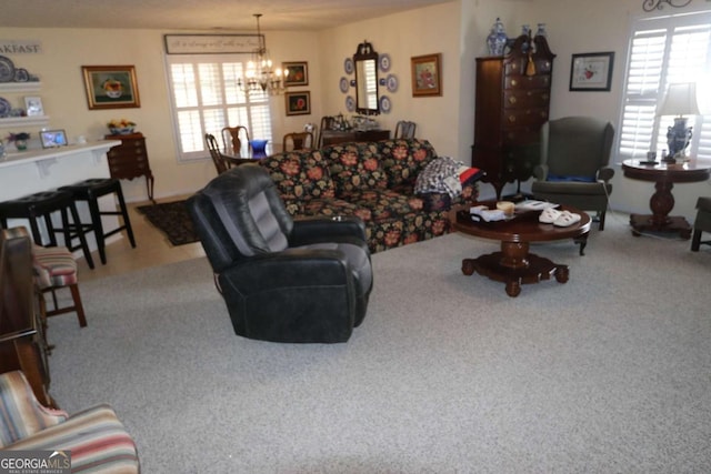 carpeted living room with a chandelier and a wealth of natural light