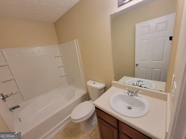 full bath with a textured ceiling, vanity, and toilet