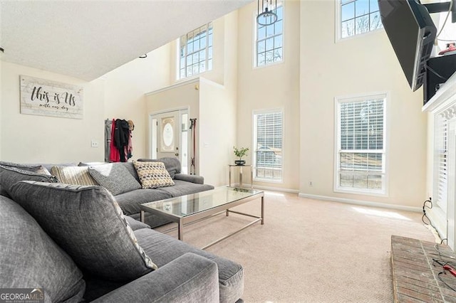 living area with carpet flooring and baseboards