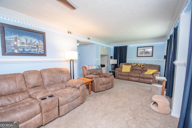 living room with ornamental molding, carpet flooring, and visible vents