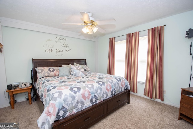 bedroom featuring ceiling fan and light colored carpet