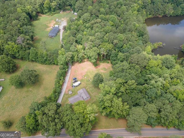 bird's eye view with a forest view and a water view