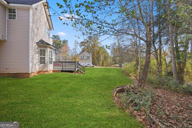 view of yard featuring a deck