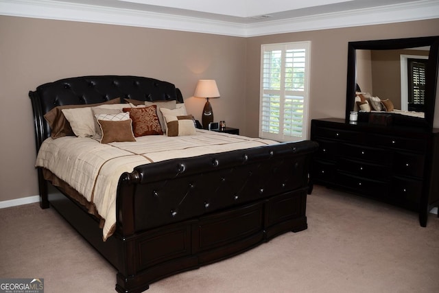 bedroom with visible vents, baseboards, light colored carpet, and ornamental molding