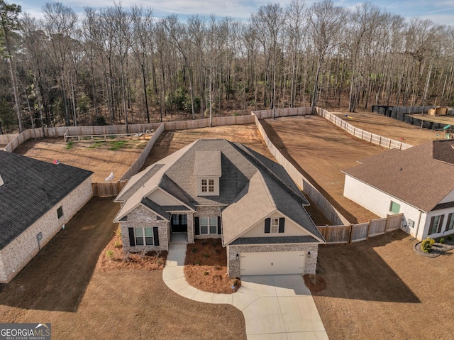 drone / aerial view with a view of trees