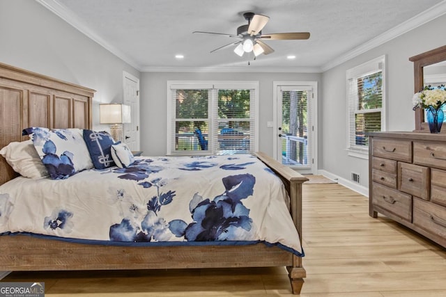 bedroom with light wood finished floors, access to outside, visible vents, and crown molding