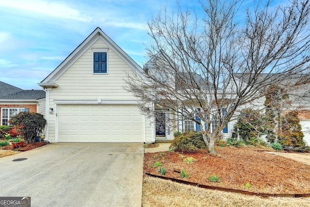 traditional-style home featuring driveway and a garage