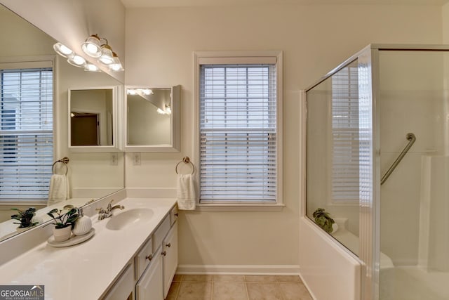 full bathroom with tile patterned flooring, a shower with door, vanity, and baseboards