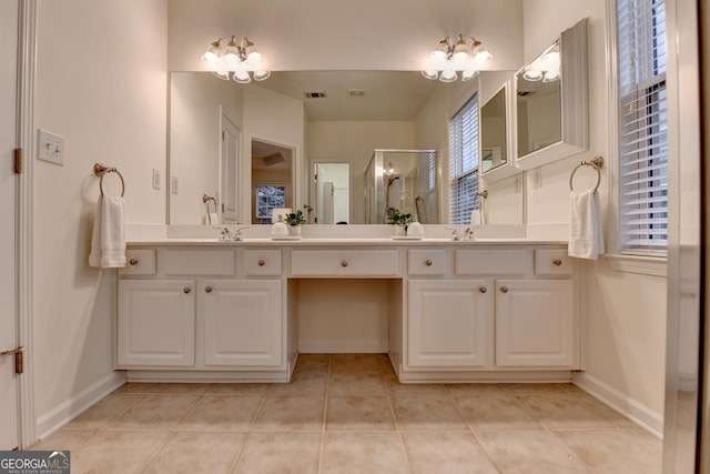 full bathroom featuring a stall shower, tile patterned flooring, visible vents, and baseboards