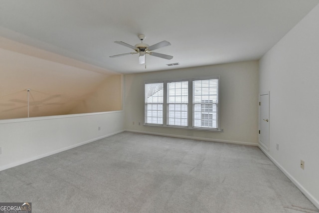 unfurnished room with a ceiling fan, baseboards, visible vents, and carpet flooring