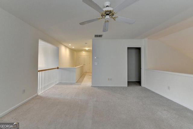 carpeted spare room featuring a ceiling fan, recessed lighting, visible vents, and baseboards