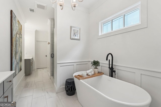 bathroom featuring vanity, a shower stall, visible vents, and marble finish floor