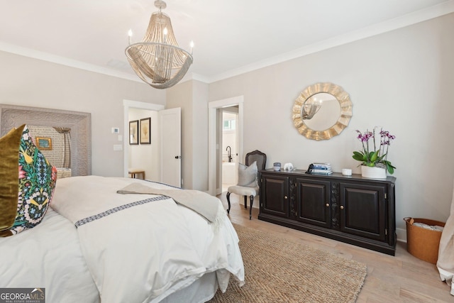 bedroom featuring a chandelier, crown molding, and light wood finished floors