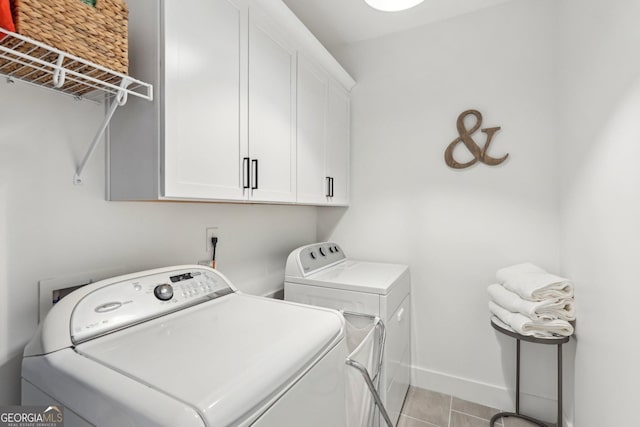 4308 Southside Dr, Acworth, GA 30101 - washroom featuring separate washer and dryer, cabinet space, and light tile patterned floors
