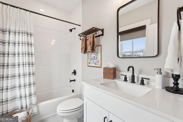 full bathroom featuring toilet, vanity, and shower / bath combo