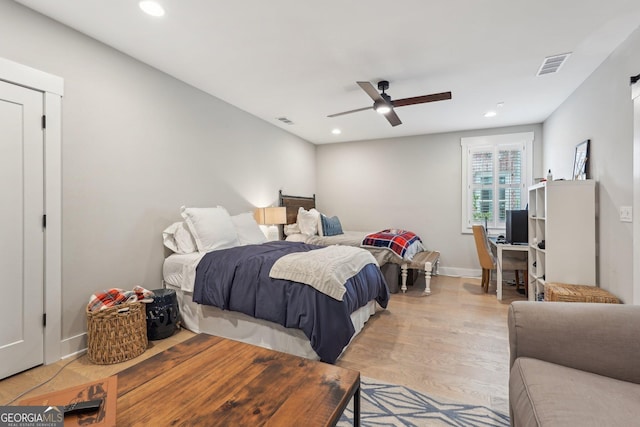 bedroom featuring visible vents, baseboards, light wood-type flooring, recessed lighting, and a ceiling fan