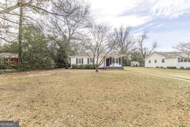 ranch-style house with a front lawn