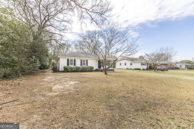 ranch-style home with a front lawn