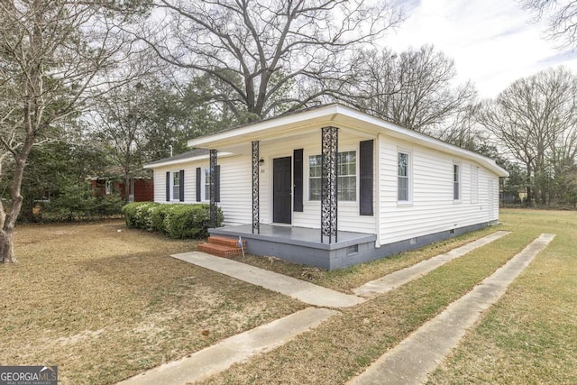 view of front of home with crawl space, covered porch, and a front yard