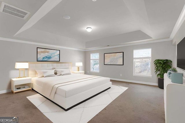 bedroom featuring carpet, visible vents, a raised ceiling, and baseboards