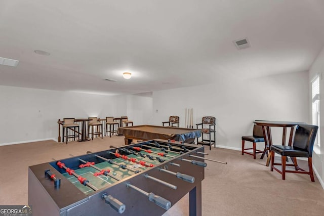 rec room with carpet floors, visible vents, and baseboards