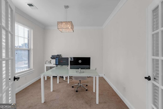 carpeted home office featuring baseboards, visible vents, ornamental molding, and french doors