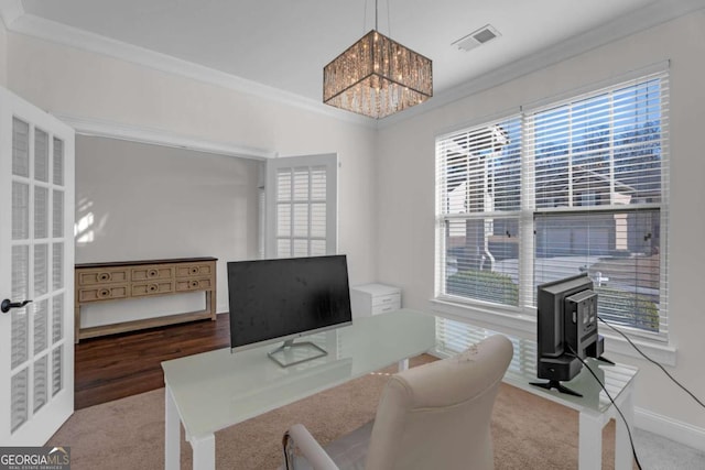 office featuring baseboards, visible vents, a chandelier, and ornamental molding