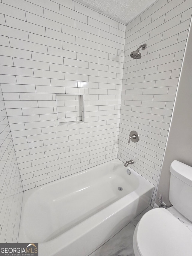 full bathroom with a textured ceiling,  shower combination, and toilet