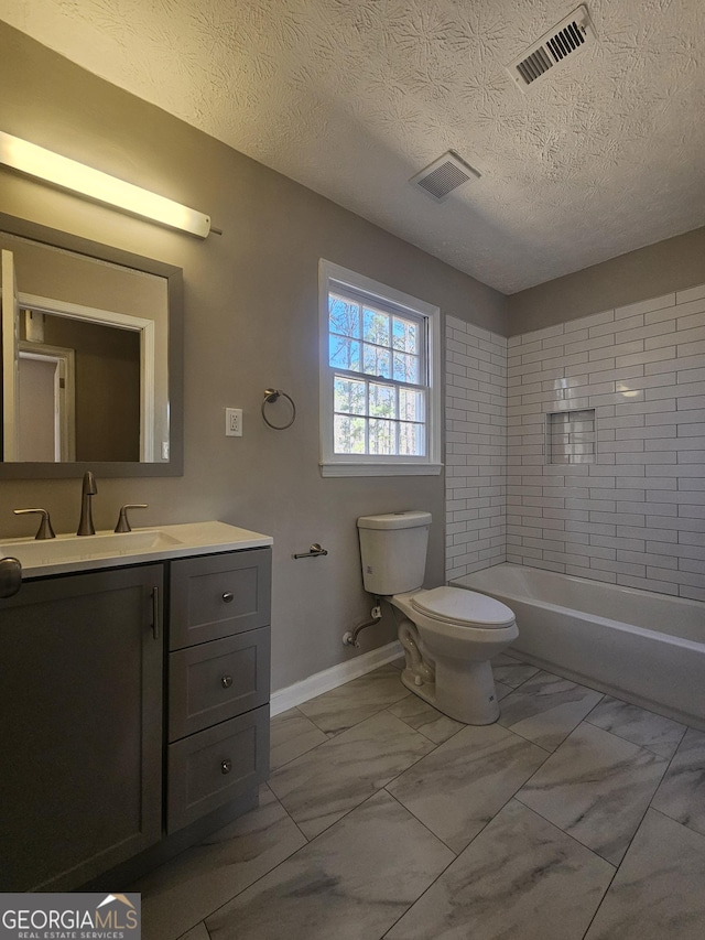 bathroom with marble finish floor, visible vents, toilet, vanity, and baseboards