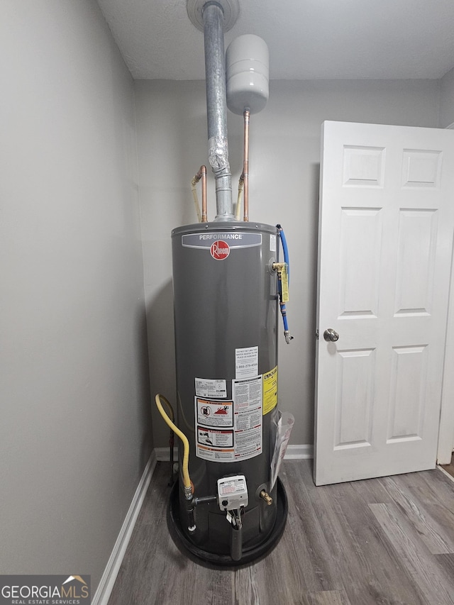 utility room featuring gas water heater