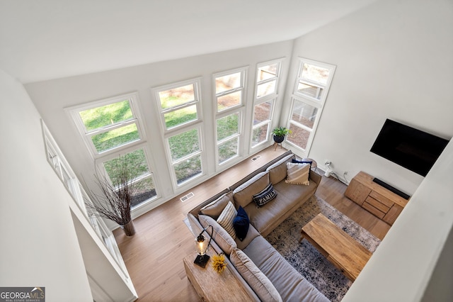 living room with visible vents and wood finished floors