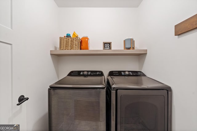 laundry room featuring washer and dryer and laundry area