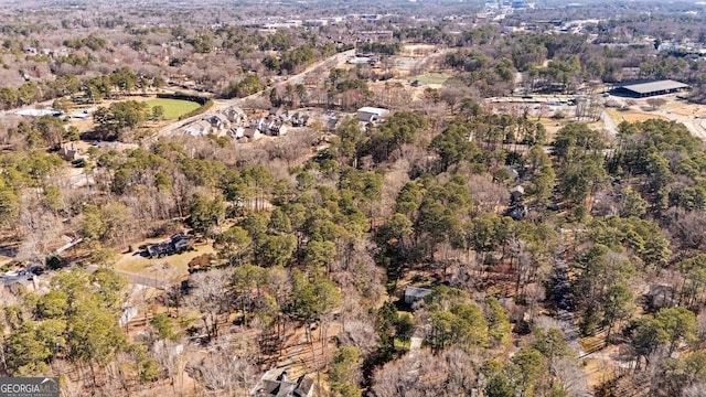 drone / aerial view featuring a forest view