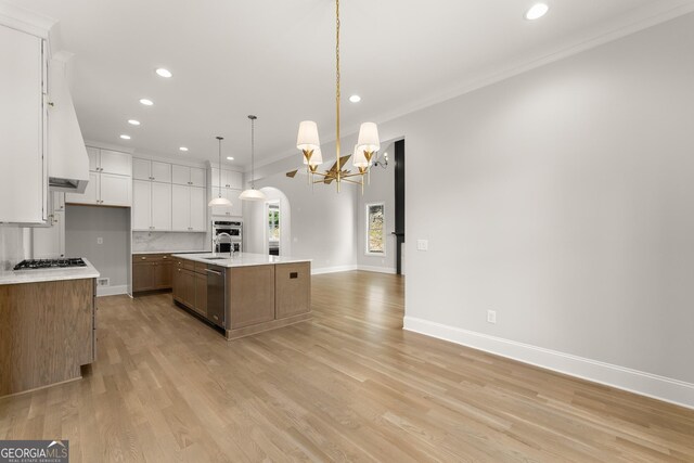 4860 Grandview Ct, Flowery Branch, GA 30542 - kitchen featuring appliances with stainless steel finishes, recessed lighting, a chandelier, ornamental molding, and light countertops