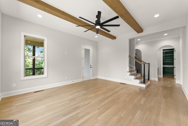 4860 Grandview Ct, Flowery Branch, GA 30542 - unfurnished living room with arched walkways, beam ceiling, a ceiling fan, light wood finished floors, and recessed lighting