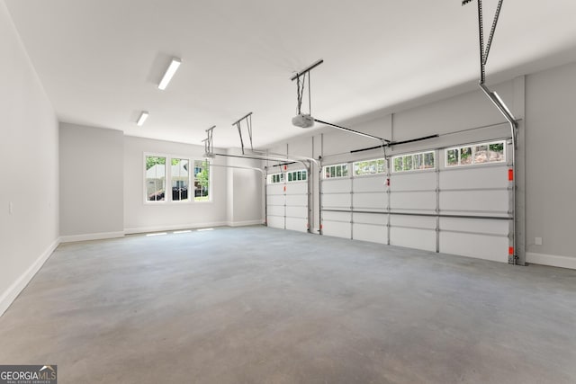 4860 Grandview Ct, Flowery Branch, GA 30542 - garage with baseboards and a garage door opener
