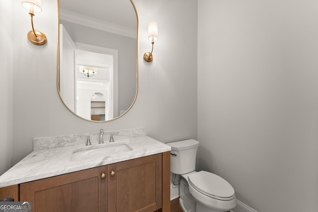 4860 Grandview Ct, Flowery Branch, GA 30542 - bathroom with toilet, vanity, crown molding, and baseboards