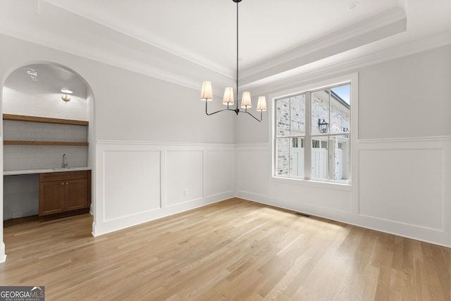 4860 Grandview Ct, Flowery Branch, GA 30542 - unfurnished dining area with a sink, ornamental molding, a raised ceiling, a decorative wall, and a wainscoted wall